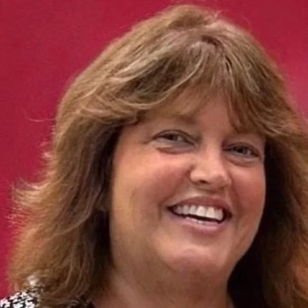 Karen, owner of Mother’s Helpers Doulas, smiling